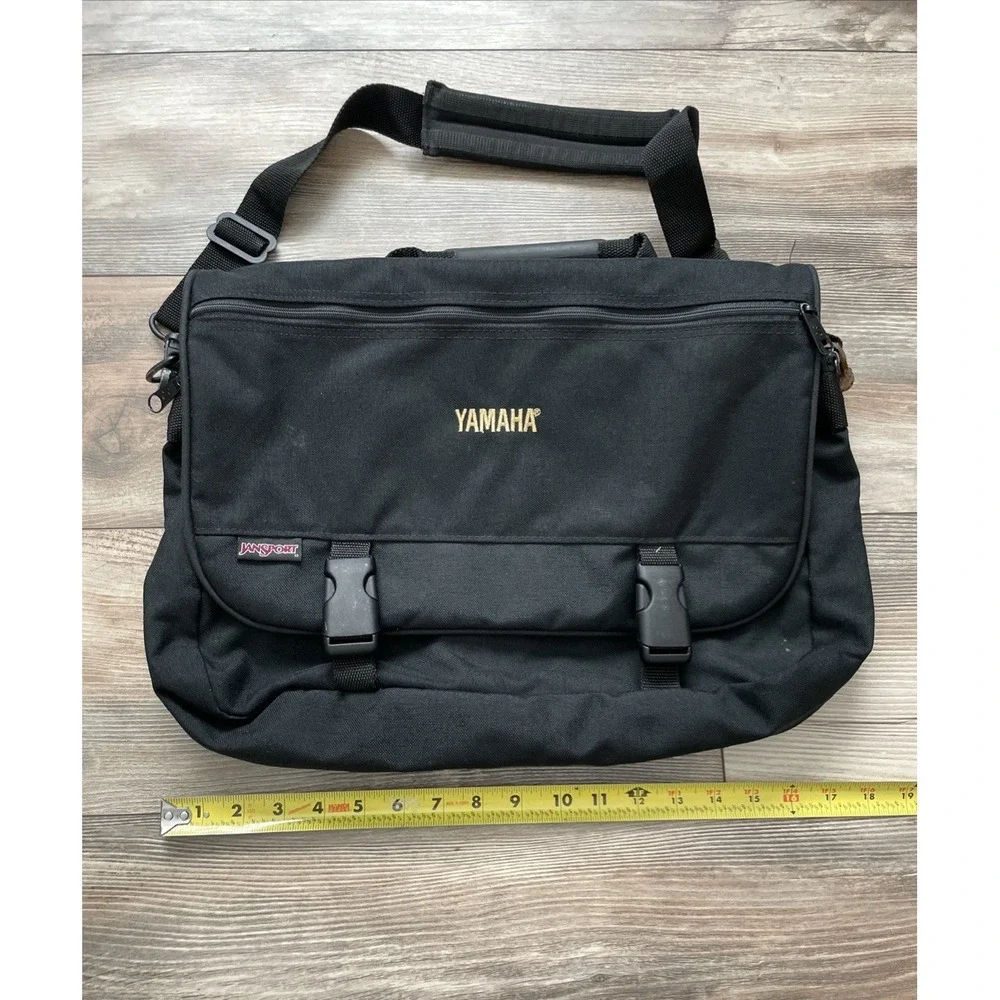 JanSport Mens Black Messenger Bag Yamaha Embroidered Suede Trim Laptop Bag